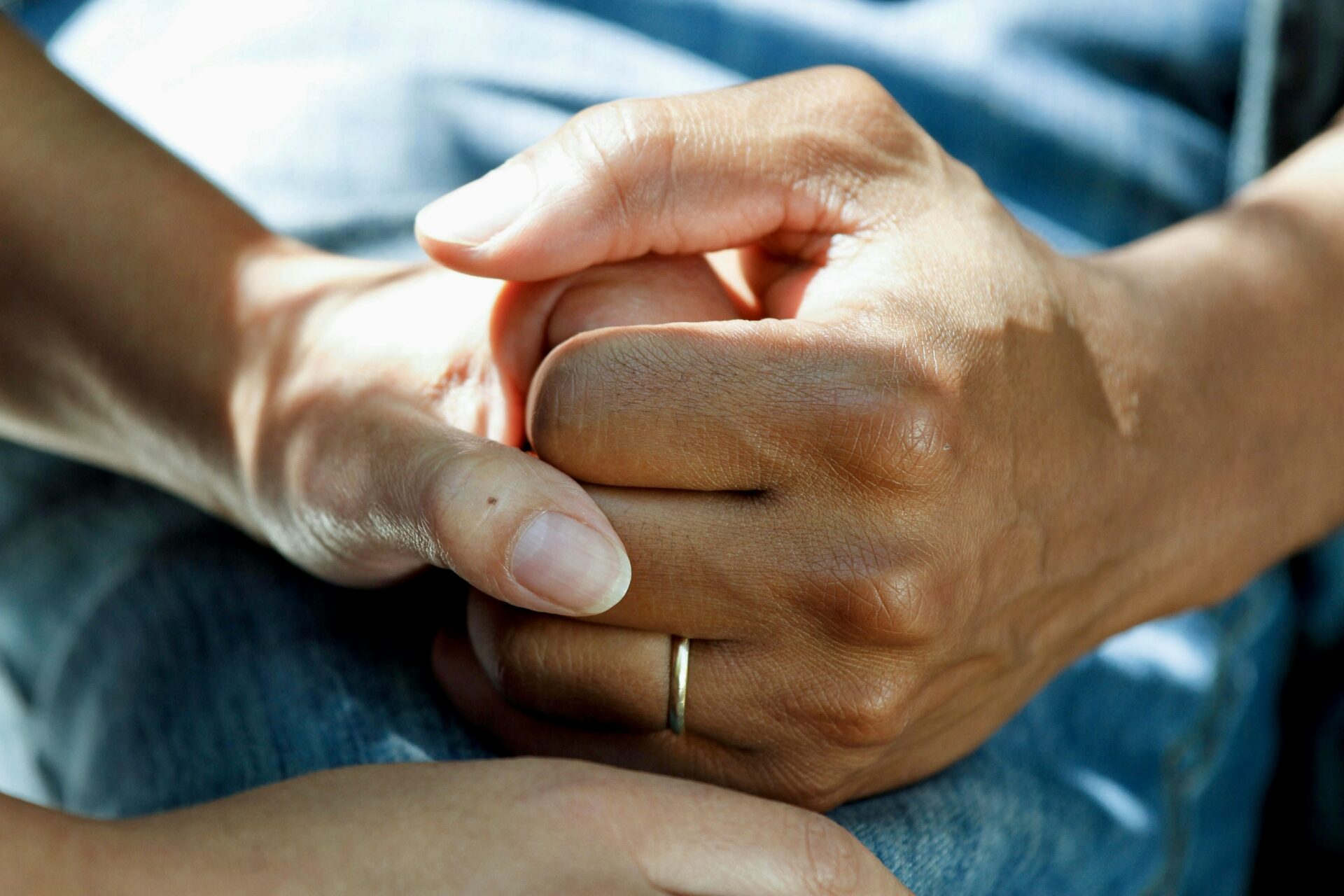 People holding hands in support